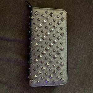 Studded zip wallet.